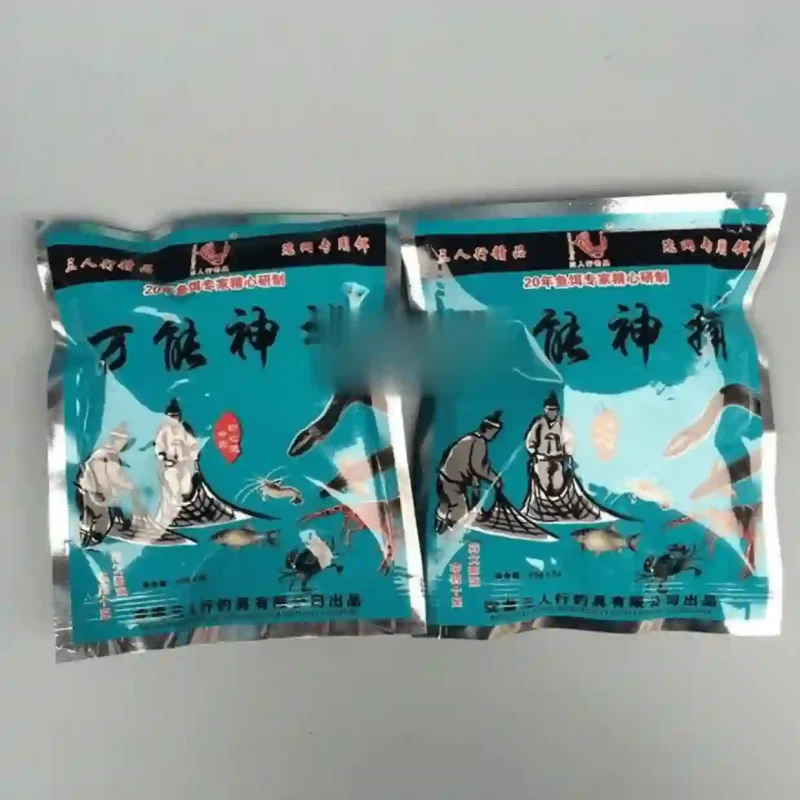 Hai gói mồi bẫy thủy sản tổng hợp, bao bì màu xanh bạc, dùng để dụ cá, tôm, cua, lươn.